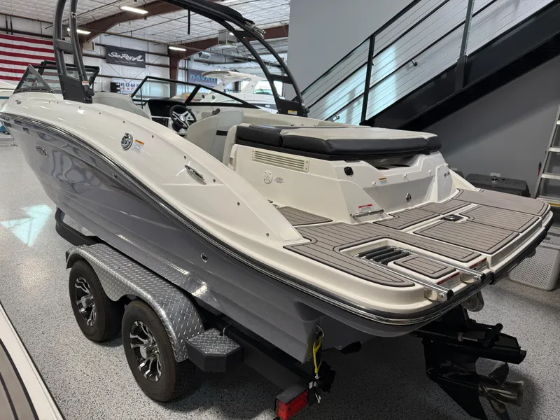 Slide: The Image of 2023 Sea Ray SPX 210 boat on trailer in showroom, rear view. - 3