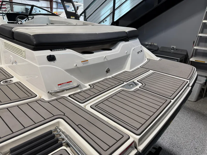 Slide: The Image of 2023 Sea Ray SPX 210 boat with sleek deck design and comfortable seating. - 4