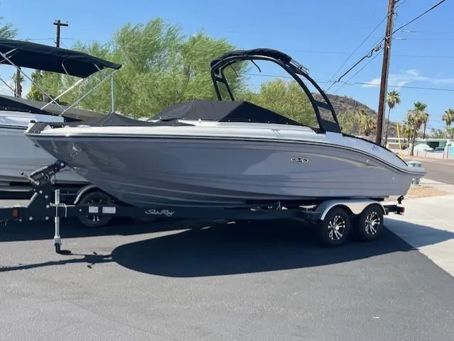 Slide: The Image of 2023 Sea Ray SPX 210 boat on trailer, parked outdoors. - 42