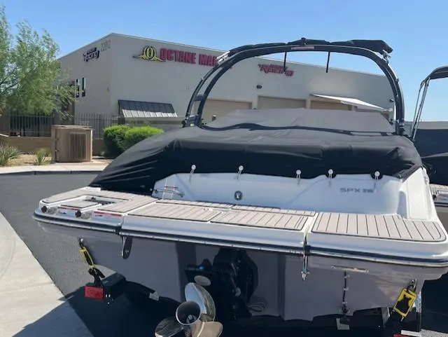 Slide: The Image of 2023 Sea Ray SPX 210 boat with cover at Octane Marine dealership. - 43