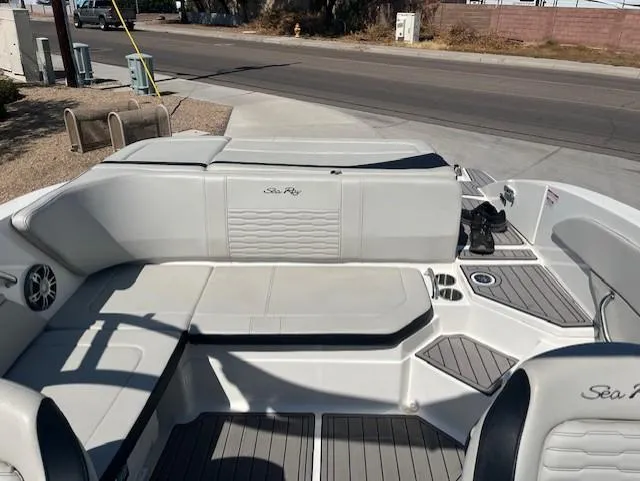 Slide: The Image of 2023 Sea Ray SPX 210 boat interior with seating and deck view. - 45