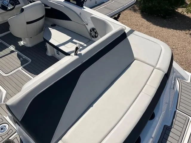 Slide: The Image of 2023 Sea Ray SPX 210 boat interior with white and black seating. - 46