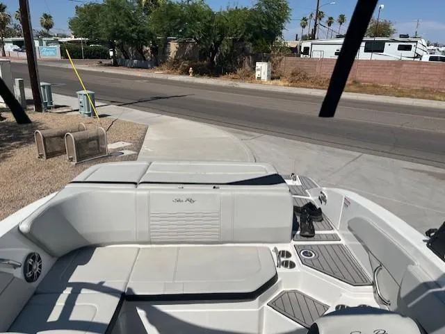 Slide: The Image of 2023 Sea Ray SPX 210 boat interior with white seating and modern design. - 49