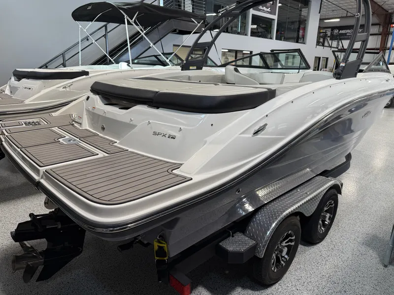 Slide: The Image of 2023 Sea Ray SPX 210 boat on trailer in showroom, rear view. - 5