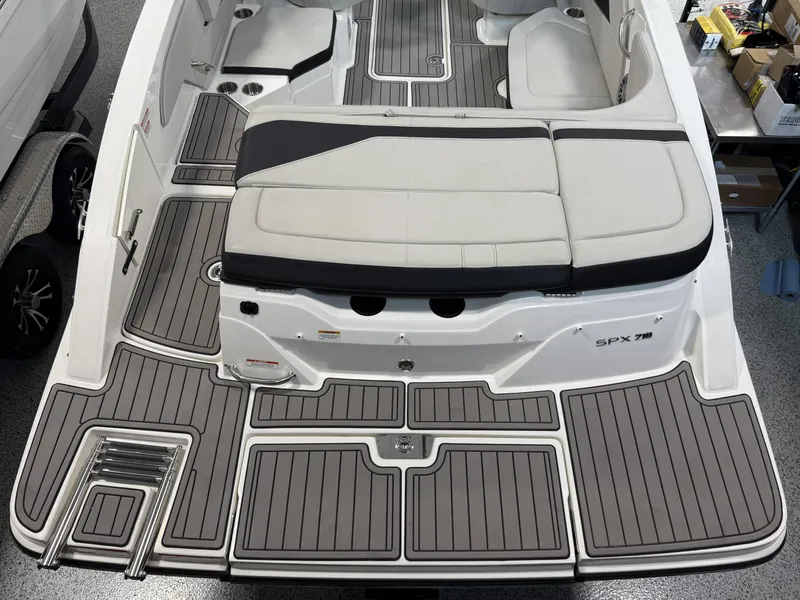 Slide: The Image of 2023 Sea Ray SPX 210 boat with spacious seating and sleek deck design. - 6
