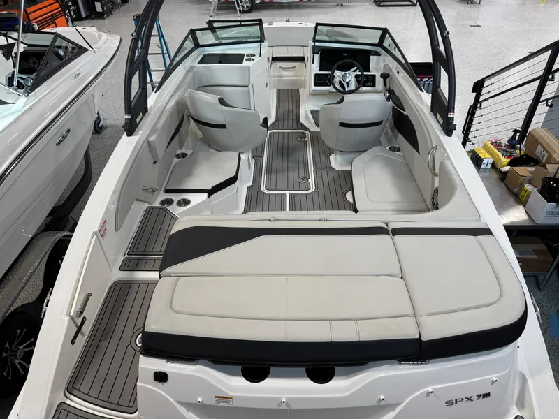 Slide: The Image of 2023 Sea Ray SPX 210 boat interior with spacious seating and modern design. - 7