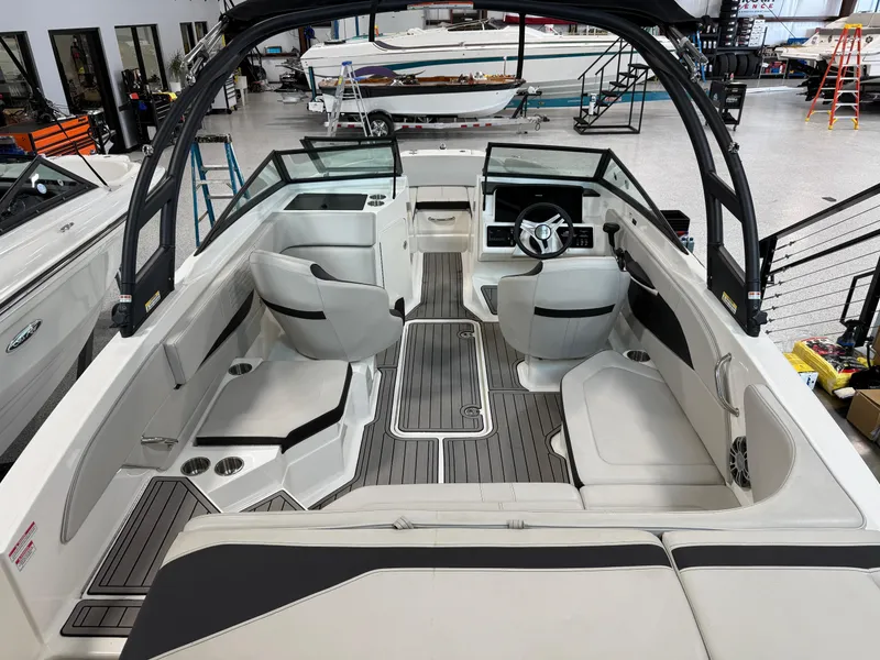Slide: The Image of 2023 Sea Ray SPX 210 boat interior with modern seating and sleek design. - 8
