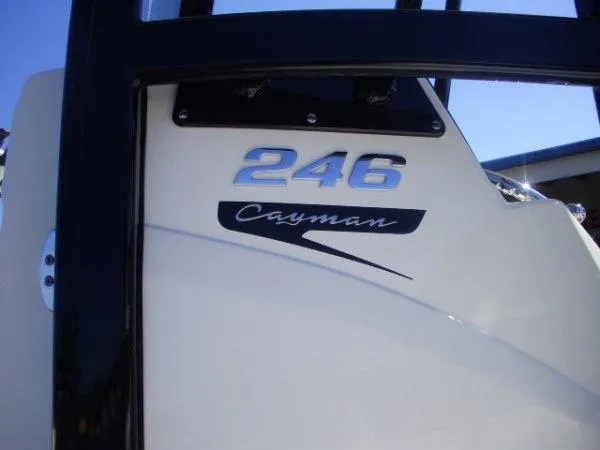 Slide: The Image of 2023 Robalo 246 Cayman boat model nameplate in sunlight. - 3