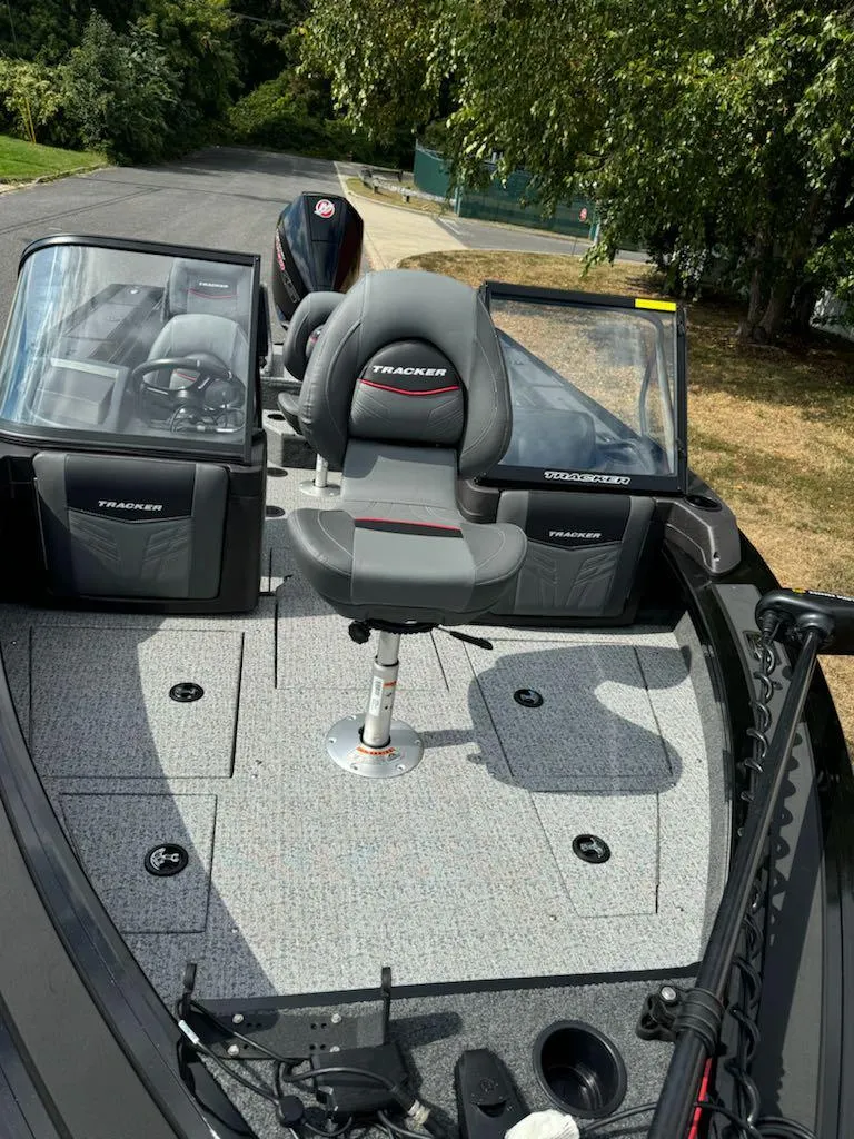 Slide: The Image of 2023 Tracker Targa V-19 WT boat interior with seating and controls. - 11