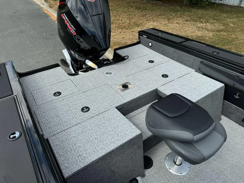 Slide: The Image of 2023 Tracker Targa V-19 WT boat with motor and seating area. - 5