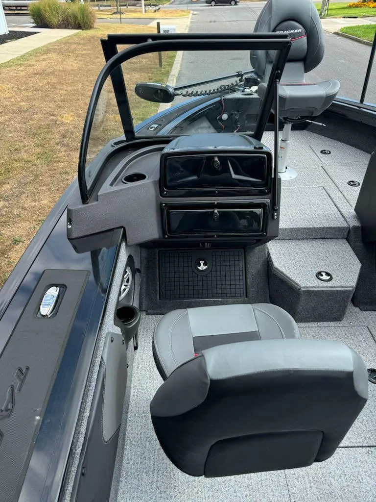 Slide: The Image of 2023 Tracker Targa V-19 WT boat interior with seating and dashboard. - 7