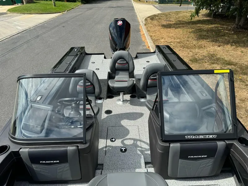 Slide: The Image of 2023 Tracker Targa V-19 WT boat interior with dual consoles and seating. - 9