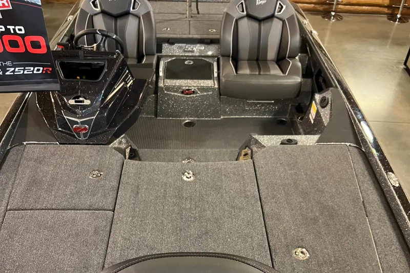 Slide: The Image of 2023 Ranger Z521R fishing boat interior with dual seats and storage compartments. - 4