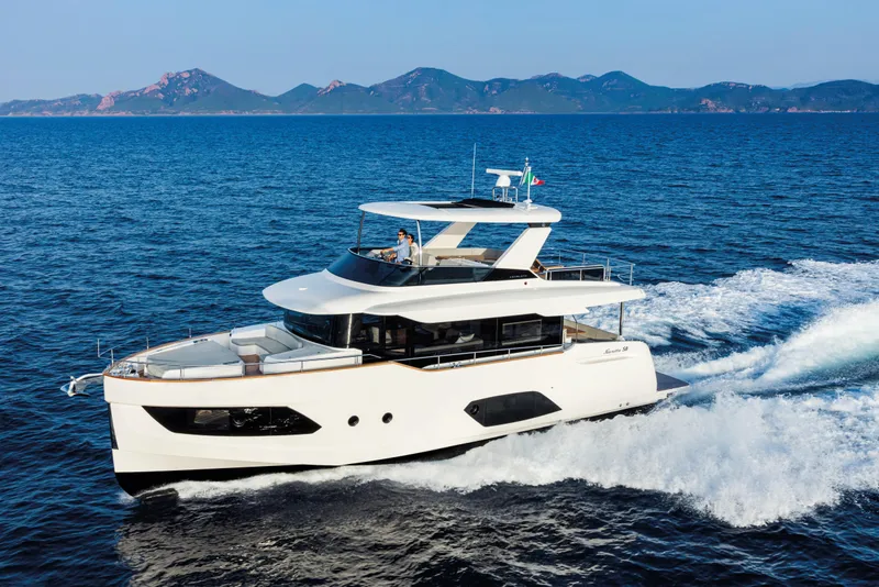 The Image of Luxury Absolute 58 Navetta yacht cruising on open sea, 2026 model. - 0