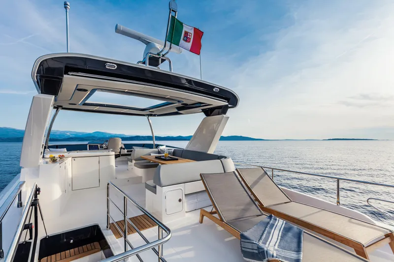 Slide: The Image of Luxurious interior of 2026 Absolute 58 Navetta yacht with modern design and ocean view. - 11