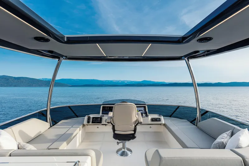 Slide: The Image of Luxurious 2026 Absolute 58 Navetta yacht deck with modern seating and ocean view. - 8