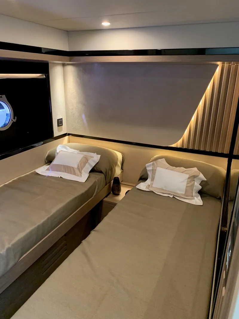 Slide: The Image of Luxurious interior of 2026 Absolute 58 Navetta yacht with modern furnishings and panoramic windows. - 18