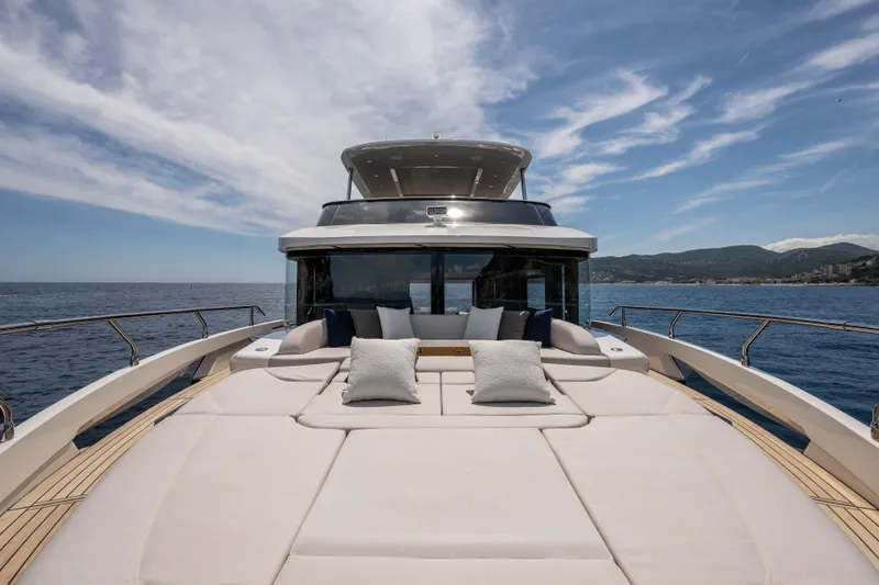 Slide: The Image of Luxurious Absolute Navetta 58 yacht deck, 2026 model, with plush seating and ocean view. - 17