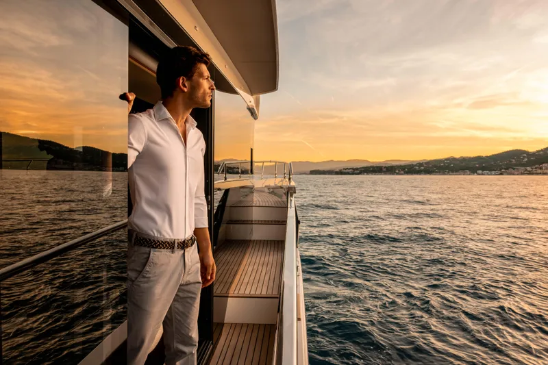 Slide: The Image of Man enjoying sunset on Absolute Navetta 58 yacht, 2026 model, at sea. - 54