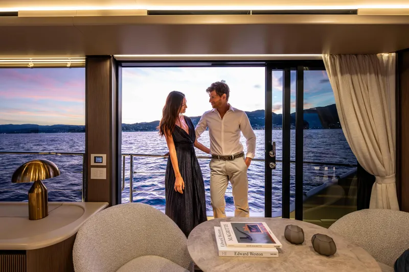 Slide: The Image of Couple enjoying sunset view on Absolute Navetta 58 yacht, 2026 model. - 52