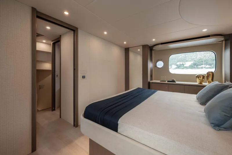 Slide: The Image of Luxurious bedroom interior of 2026 Absolute Navetta 58 yacht with scenic window view. - 46