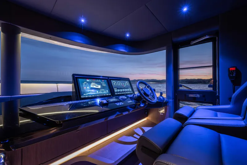 Slide: The Image of Luxurious 2026 Absolute Navetta 58 yacht cockpit with advanced navigation screens at sunset. - 53