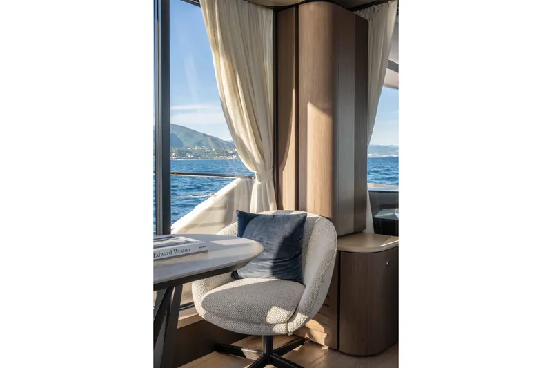 Slide: The Image of Luxurious interior of 2026 Absolute Navetta 58 yacht with ocean view and elegant seating. - 37