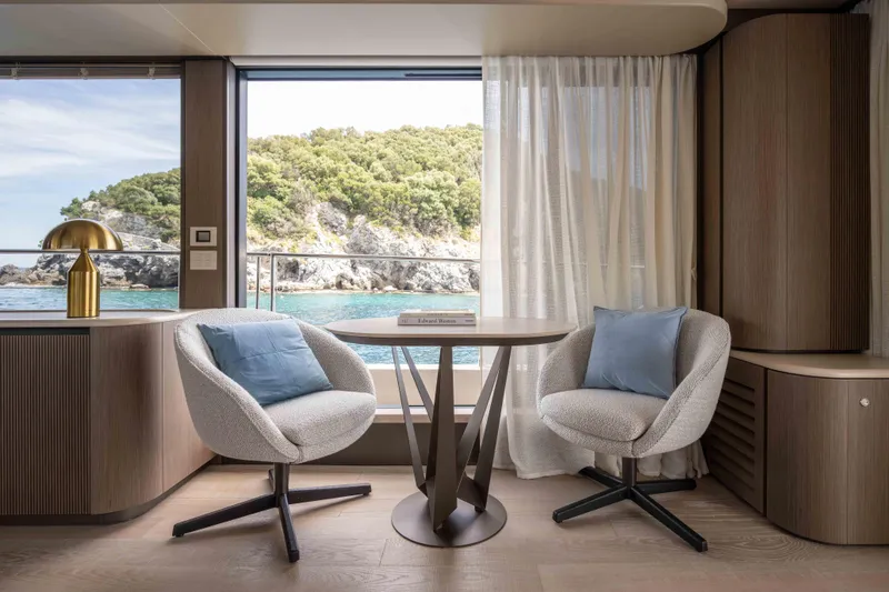 Slide: The Image of Luxurious interior of 2026 Absolute Navetta 58 yacht with elegant seating and ocean view. - 30