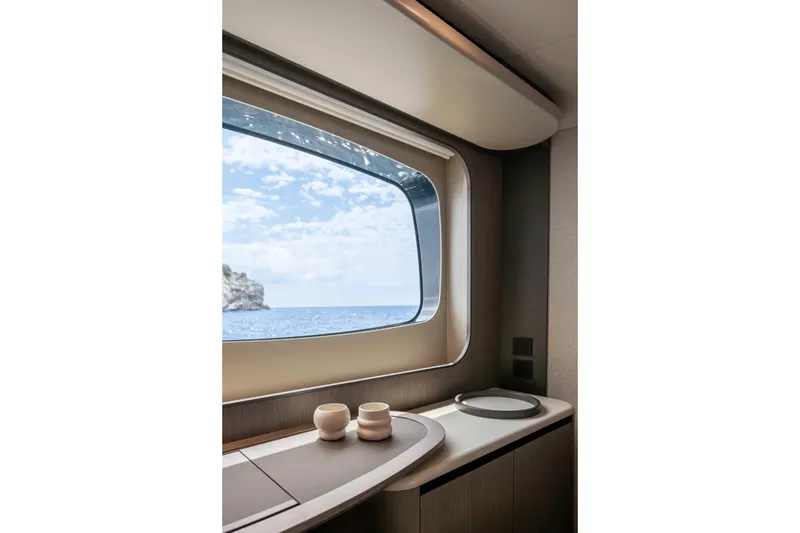 Slide: The Image of Interior view from Absolute Navetta 58 yacht, showcasing ocean through window, 2026 model. - 39