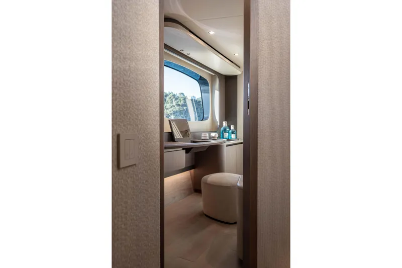 Slide: The Image of Luxurious interior of 2026 Absolute Navetta 58 yacht with elegant vanity and ocean view. - 43