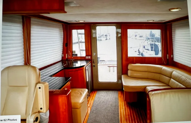 Slide: The Image of Interior of 2004 Legacy Downeast boat with leather seating and wood accents. - 14