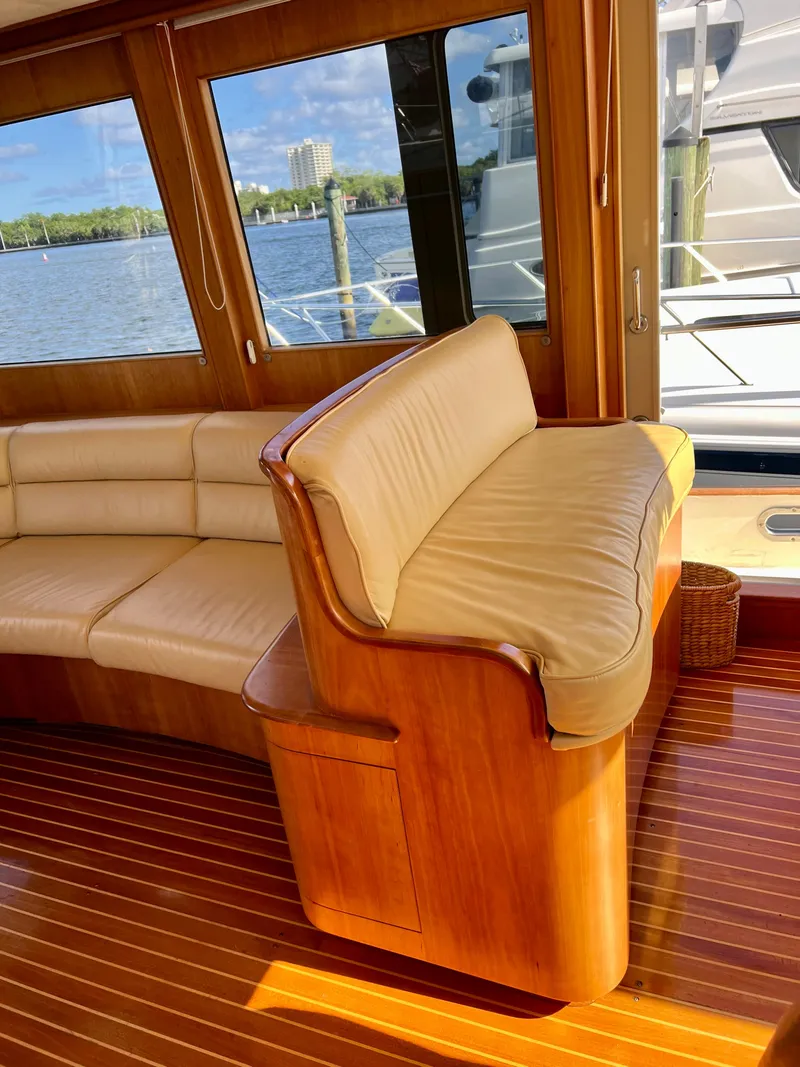 Slide: The Image of Luxurious 2004 Legacy Downeast yacht interior with leather seating and wooden flooring. - 16