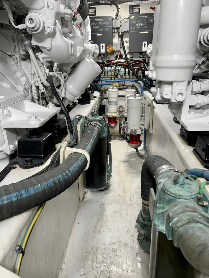 Slide: The Image of Engine room of 2004 Legacy Downeast boat with visible machinery and components. - 26