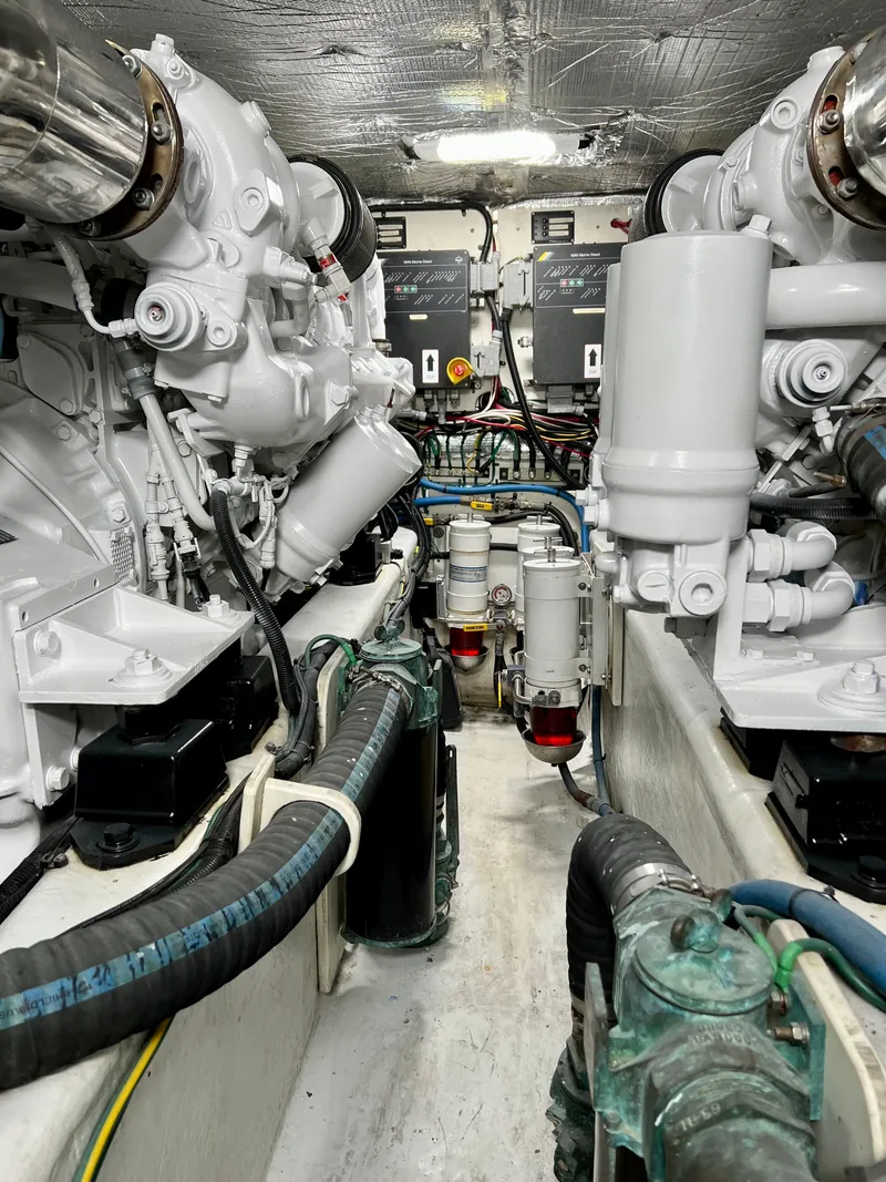 Slide: The Image of Engine room of 2004 Legacy Downeast boat with visible machinery and components. - 27