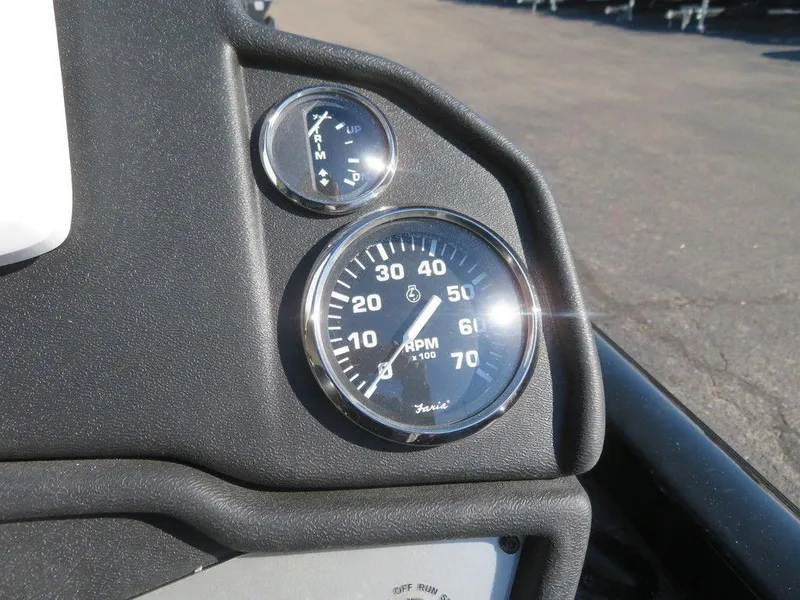 Slide: The Image of Close-up of 2023 Ranger RT188 boat dashboard with RPM and fuel gauges. - 12