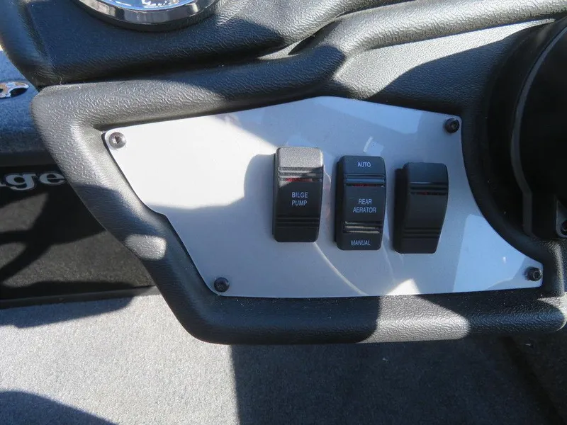 Slide: The Image of Control panel of 2023 Ranger RT188 boat with bilge pump and aerator switches. - 13