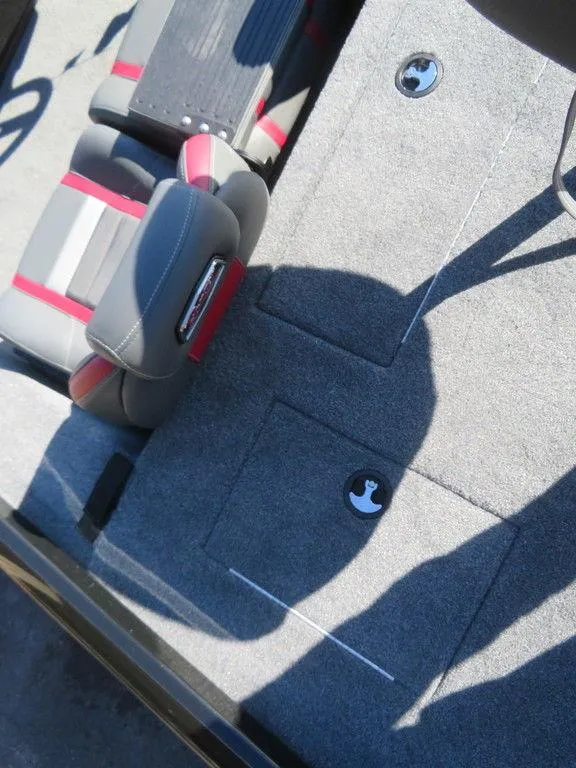 Slide: The Image of 2023 Ranger RT188 boat interior with gray and red seating, carpeted flooring. - 14
