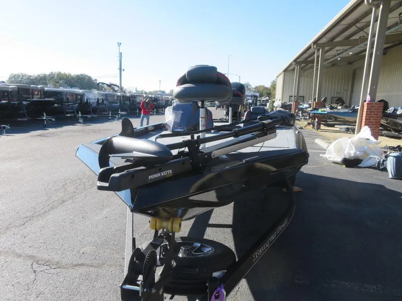 Slide: The Image of 2023 Ranger RT188 boat parked outdoors, featuring Minn Kota trolling motor. - 17