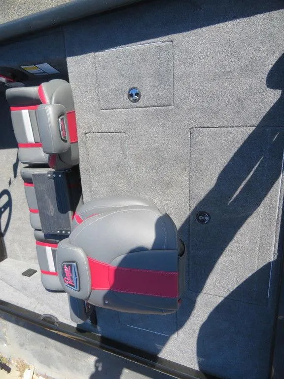 Slide: The Image of 2023 Ranger RT188 boat interior with gray and red seating. - 18