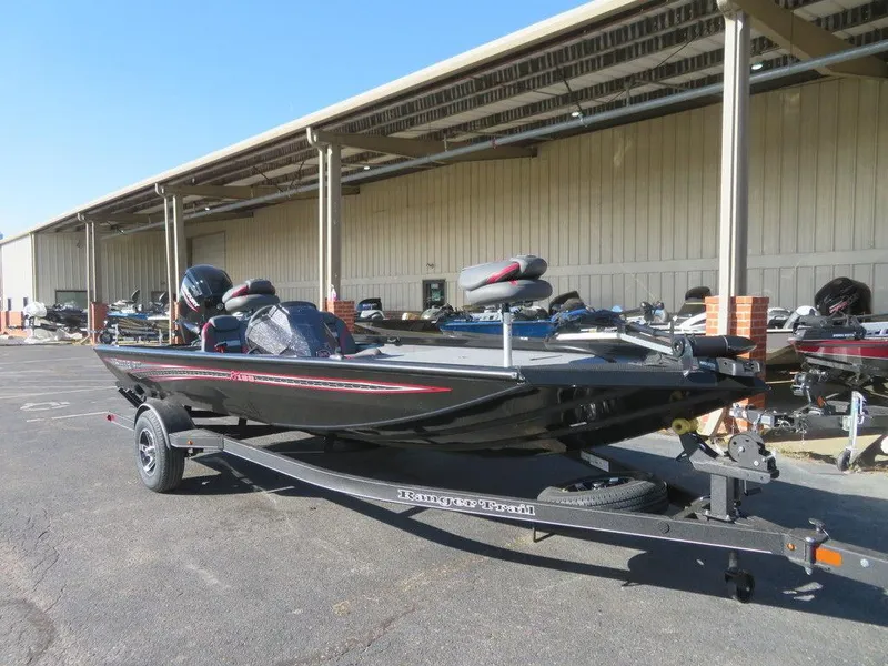 Slide: The Image of 2023 Ranger RT188 boat parked outdoors on a trailer. - 19