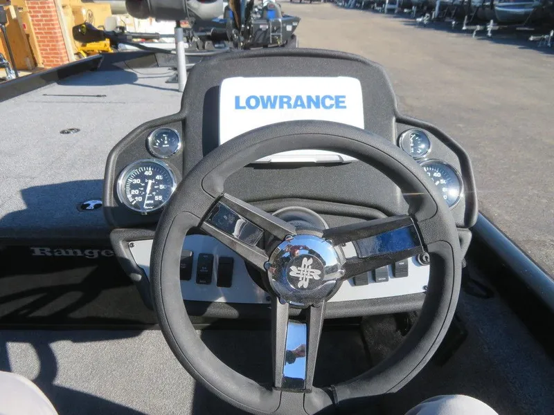 Slide: The Image of 2023 Ranger RT188 boat dashboard with Lowrance display and steering wheel. - 7