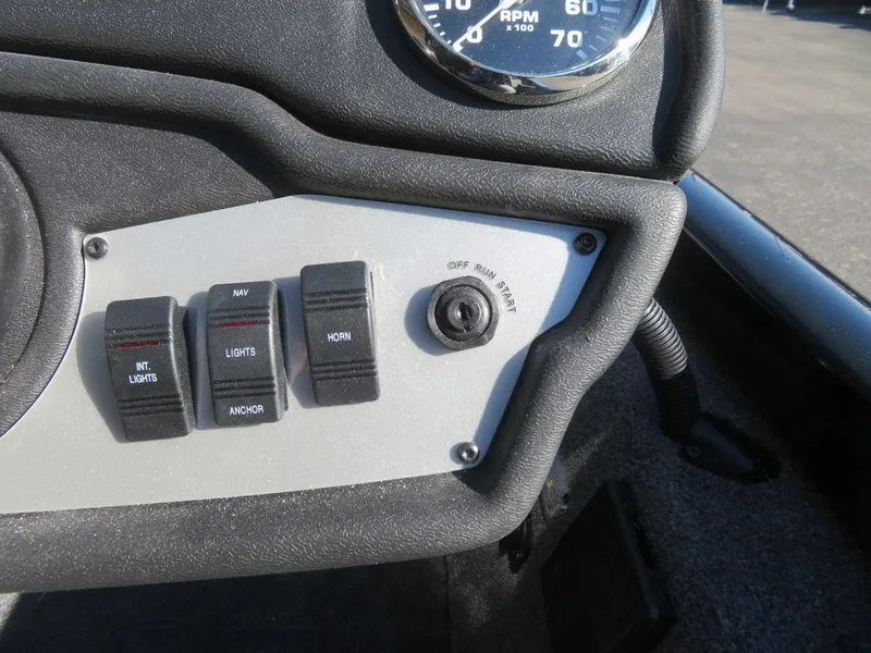 Slide: The Image of Dashboard controls of 2023 Ranger RT188 boat with switches and gauge. - 9