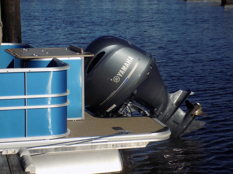 Slide: The Image of 2021 Sylvan L3 Party Fish pontoon boat with Yamaha outboard motor on water. - 7
