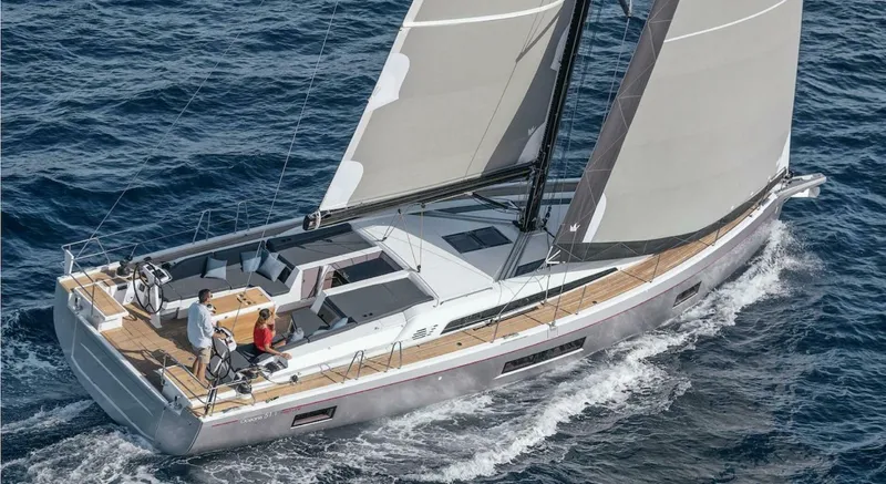 The Image of 2024 Beneteau Oceanis 51.1 sailing on open water, showcasing sleek design and spacious deck. - 0