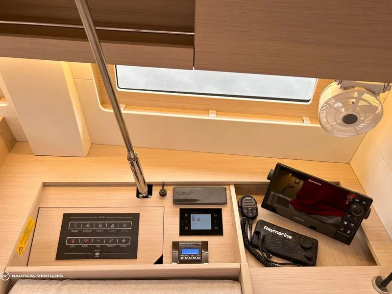 Slide: The Image of Interior of 2024 Beneteau Oceanis 51.1 yacht with navigation equipment and control panel. - 16