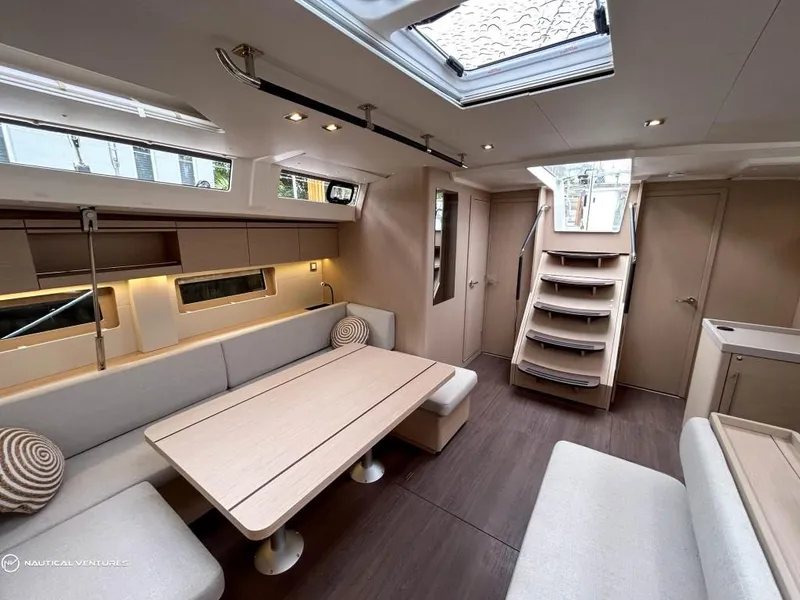 Slide: The Image of Luxurious interior of 2024 Beneteau Oceanis 51.1 yacht with modern seating and skylight. - 18