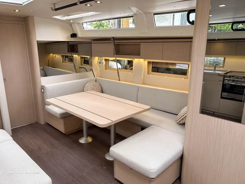 Slide: The Image of Luxurious interior of 2024 Beneteau Oceanis 51.1 yacht with modern dining area. - 20