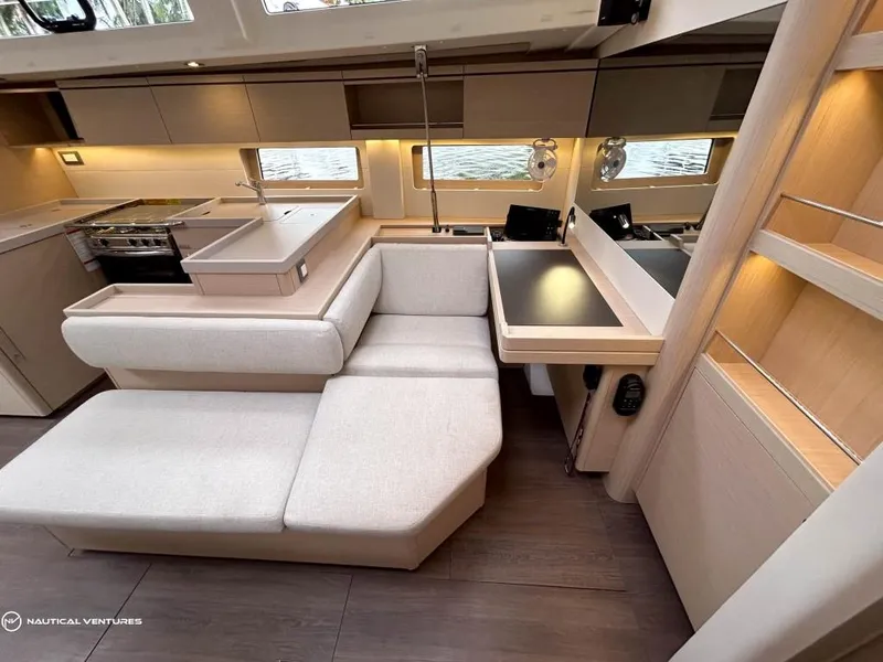 Slide: The Image of Luxurious interior of 2024 Beneteau Oceanis 51.1 yacht with modern kitchen and seating area. - 22