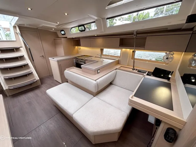 Slide: The Image of Luxurious interior of 2024 Beneteau Oceanis 51.1 yacht with modern furnishings and ample natural light. - 24