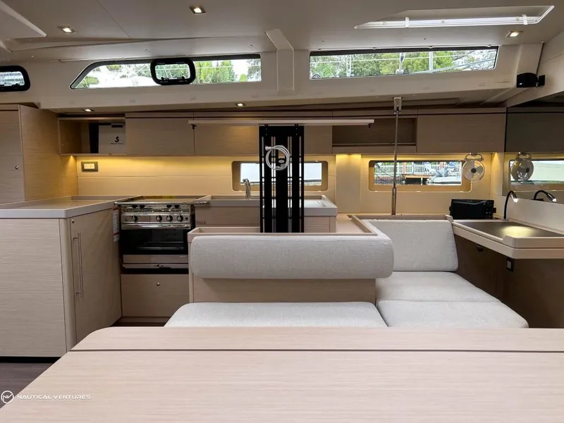 Slide: The Image of Luxurious interior of 2024 Beneteau Oceanis 51.1 yacht with modern kitchen and seating area. - 26